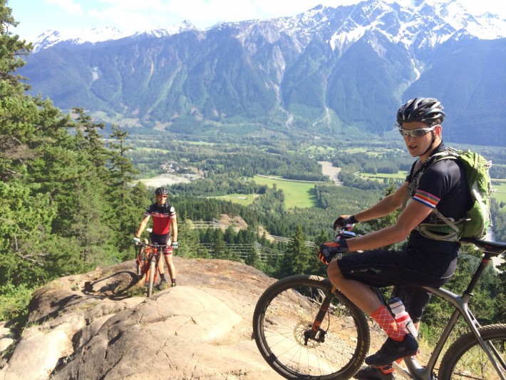 NIMBY 50: Mount Currie presides. Parkin & Terry pre-riding the course and soaking up (so much) sun.